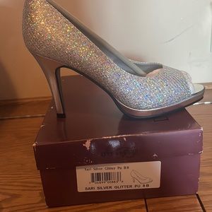 Never dyed. Ordered for wedding and found another pair. Sparkly silver heel.